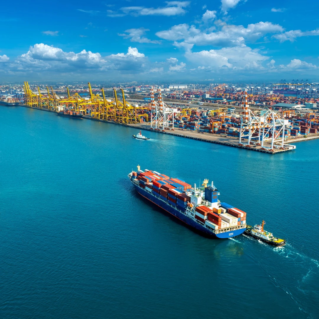 Cargo ship sailing into port image